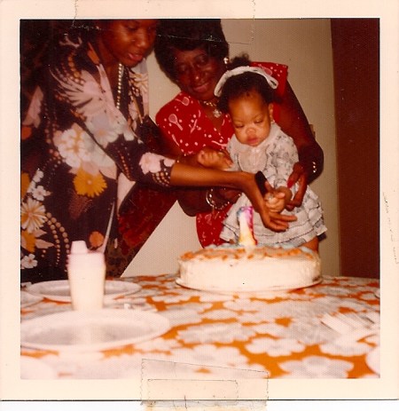 September 26, 1974. My first birthday. Holding me is my paternal grandmother, Ollie King. And helping to light the candle is my mother, Rita Moore King. I watched my mom pitch things from Essence to Reader's Digest. I walked with her to the mailbox to send off her pitches. I felt the nervous joy radiating from her as we walked back home to wait. I felt her wince when the fancy letterhead came with nicely worded rejection letters. She edited my first words. And has saved every. single. thing I've ever written. From love letters to books. She's my favorite writer. 