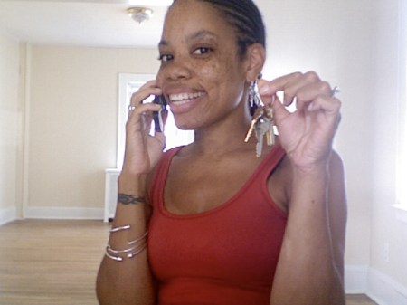 Caling my mom, two seconds after the closing. Little did I know, a year later, I'd still have no furniture. And thirty minutes after this picture was taken, raw sewage started coming out of my kitchen sink. Nice!